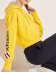 SUPERDRY sieviešu dzeltens īss džemperis ar kapuci BASIC W SPORTSTYLE GRAPHIC BOXY HOOD SWEATER